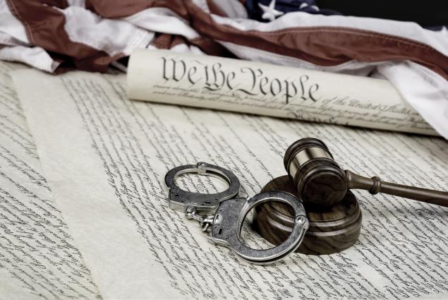 civil rights constitution gavel and handcuffs